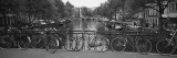 Bicycle Leaning Against a Metal Railing on a Bridge, Amsterdam, Netherlands