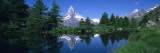 Reflection of a Snow Covered Mountain in a Lake, Grindjisee, Matterhorn, Zermatt, Switzerland