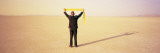Businessman Measuring the Sky with a Tape Measure, Black Rock Desert, Nevada, USA