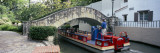 Boat Passing under a Bridge, Arneson River Theater, Arneson River, San Antonio, Texas, USA