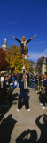 Woman Standing One Leg on a Man Hand and Performing a Stunt, University of Notre Dame