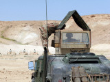 An Instructor Watches an Iraqi Army Soldier in the School of Infantry Fire a Pkc Machine Gun
