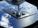 Buy A B-2 Spirit Moves into Position for Refueling from a KC-135 Stratotanker Over the Pacific Ocean at AllPosters.com