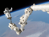 Buy Astronaut Anchored to a Foot Restraint on the International Space Station's Canadarm2 at AllPosters.com