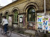 Buy Cyclist in Freetown Christiania, with Anti European Union Posters on Wall at AllPosters.com