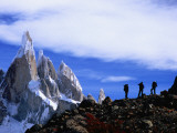 Hikers on a Ridge Dwarfed by Cerro Torre