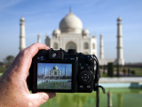 Tourist Taking Picture of Taj Mahal