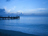 Buy Tourists Watching Sunset from Occidental Grand Cozumel Resort Pier at AllPosters.com