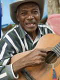 Man Singing and Playing Guitar