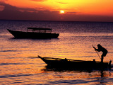 Man Poling Outrigger Off Nungwi Beach