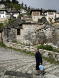 Woman Walking Up Cobbled Street