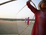 Ethnic Cham Women Cross Large Sand Dune in Central Vietnam