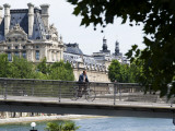 Cyclist on Passerelle Leopold Sangor