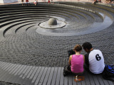 Buy Couple Looking at the Spiral Fountain at the Sydney Convention Centre, Darling Harbour at AllPosters.com
