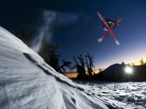 Skier Jumping and Grabbing His Skis at Mout Bachelor