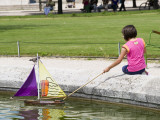 Buy Girl with Toy Boat in Pond of Jardin Des Tuileres at AllPosters.com