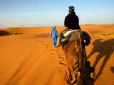 Traveller Riding Camel at Erg Chebbi