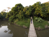 Tourist on Suspension Bridge over Gumeti River, Grumeti