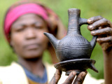 Buy Dorze Woman with Black Coffee Pot at AllPosters.com