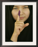 Young Girl Shows Her Inked Finger, Even Though She Was Too Young to Vote, in Karbala, Iraq