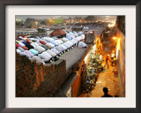 Indian Muslims During Friday Evening Prayers on the Rooftop of a Building over an Auto Parts Market