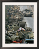 Israeli Soldiers Sleep on Top of Their Armored Vehicles