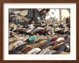 Kashmiri Eartquake Survivors Pray Amid the Debris of a Destroyed Building During the Eid Al-Fitr