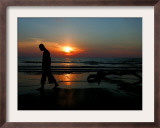 Buddhist Monk Walks Along the Beach During Sunset in Khoa Lak, Thailand - Party Travel