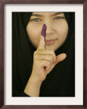 Young Girl Shows Her Inked Finger, Even Though She Was Too Young to Vote, in Karbala, Iraq