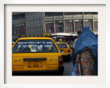 Buy An Afghan Woman Clad in a Burqa Walks Next to a Taxi in Kabul, Afghanistan, Wednesday, June 7, 2006 at AllPosters.com