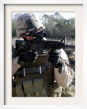 Soldier Looks Through the Scope of M-4 Carbine Rifle