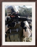 Soldier Looks Through the Scope of M-4 Carbine Rifle