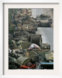Israeli Soldiers Sleep on Top of Their Armored Vehicles