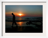 Buddhist Monk Walks Along the Beach During Sunset in Khoa Lak, Thailand - Party Travel