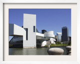 A Ring-Billed Gull Takes Flight in Front of the Rock and Roll Hall of Fame and Museum