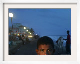 A Sri Lankan Boy Looks as He Sells Prawns at the Sea Front, in Colombo, Sri Lanka, June 30, 2006