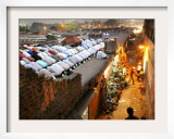 Indian Muslims During Friday Evening Prayers on the Rooftop of a Building over an Auto Parts Market