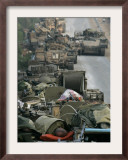 Israeli Soldiers Sleep on Top of Their Armored Vehicles