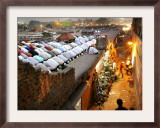 Indian Muslims During Friday Evening Prayers on the Rooftop of a Building over an Auto Parts Market