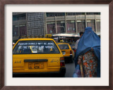 Buy An Afghan Woman Clad in a Burqa Walks Next to a Taxi in Kabul, Afghanistan, Wednesday, June 7, 2006 at AllPosters.com