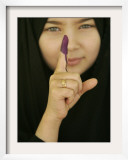 Young Girl Shows Her Inked Finger, Even Though She Was Too Young to Vote, in Karbala, Iraq