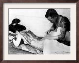 An Unidentified Japanese Tattoo Artist Works on a Woman