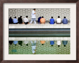 With the Water Reflection, a Muslim Man Walks Past Others Offering the Friday Prayer at a Mosque