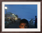 A Sri Lankan Boy Looks as He Sells Prawns at the Sea Front, in Colombo, Sri Lanka, June 30, 2006
