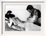 An Unidentified Japanese Tattoo Artist Works on a Woman