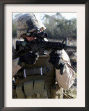 Soldier Looks Through the Scope of M-4 Carbine Rifle