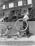 Boy Outside Front of House, Bicycle Upside Down, Spinning Front Wheel