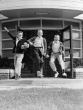 Three Excited Boys Running Out of School