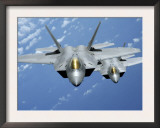 Two F-22 Raptors Fly over the Pacific Ocean