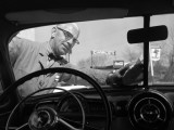 Service Station Attendant in a Bow Tie Washing Customers Windshield